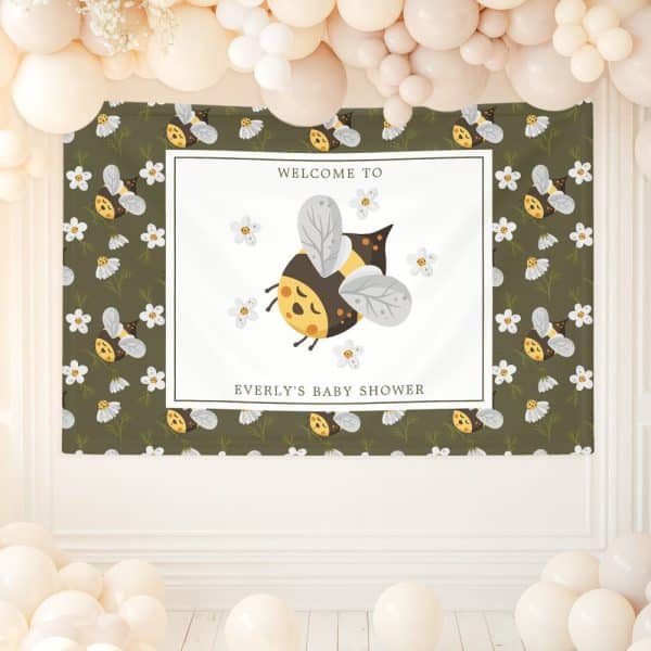 A Baby Shower Banner Featuring A Cartoon Bumble Bee Surrounded By Small Flowers. The Banner Says Welcome To Everly'S Baby Shower.