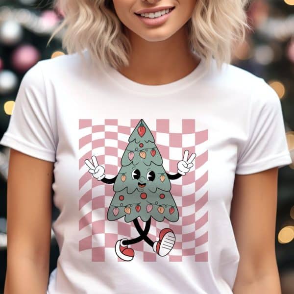Woman Wearing A White T-Shirt Featuring A Cartoon Christmas Tree.