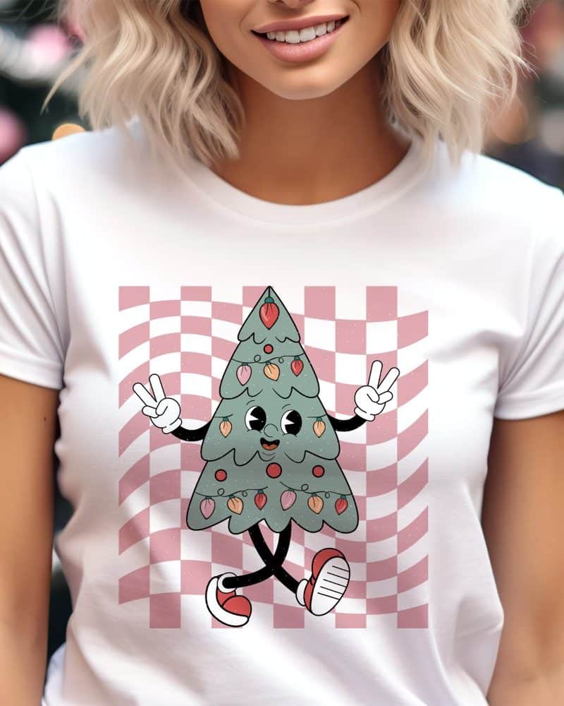 Woman wearing a white t-shirt featuring a cartoon Christmas tree.