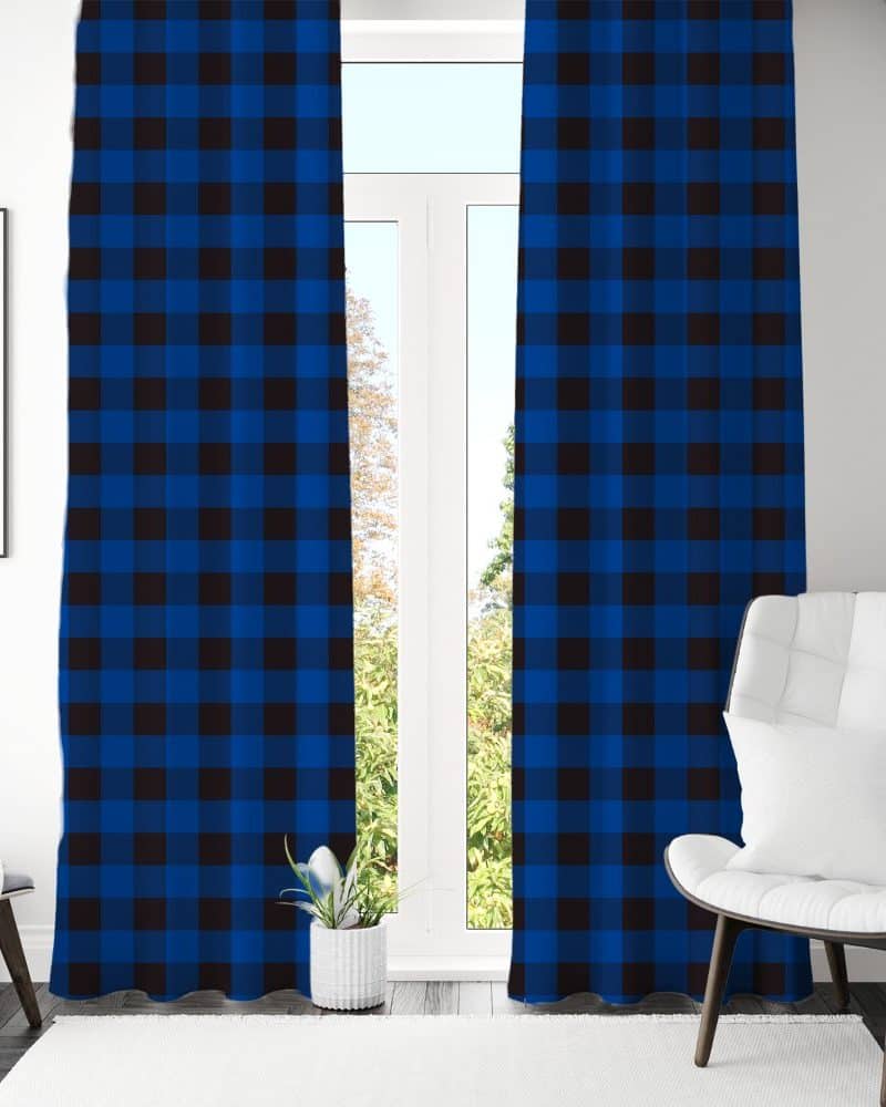Blue and black buffalo plaid curtains hanging in a window.