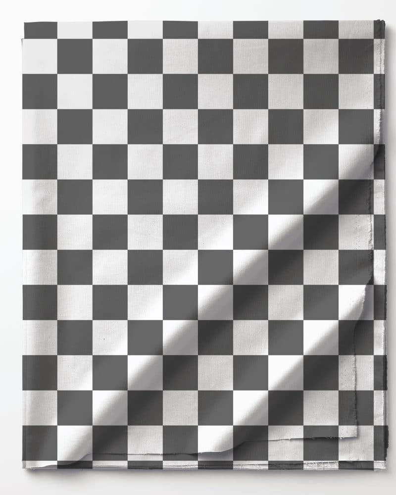 Black and white checkered fabric folded on a white background.