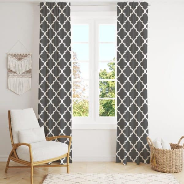 Dark Gray Curtains With A White Quatrefoil Pattern Hang On A Window.