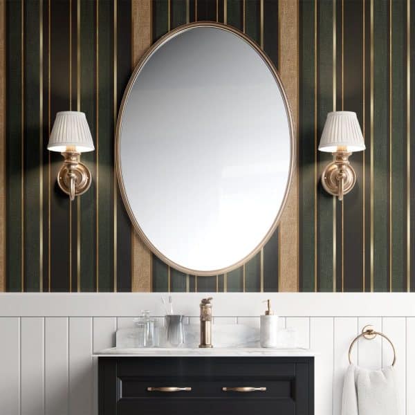 Large Oval Mirror Flanked By Wall-Mounted Lights Above A Bathroom Vanity.
