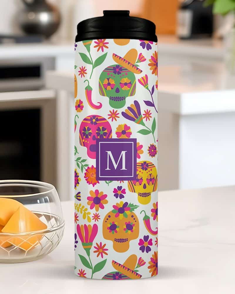 Personalized travel tumbler with a Day of the Dead sugar skull design.