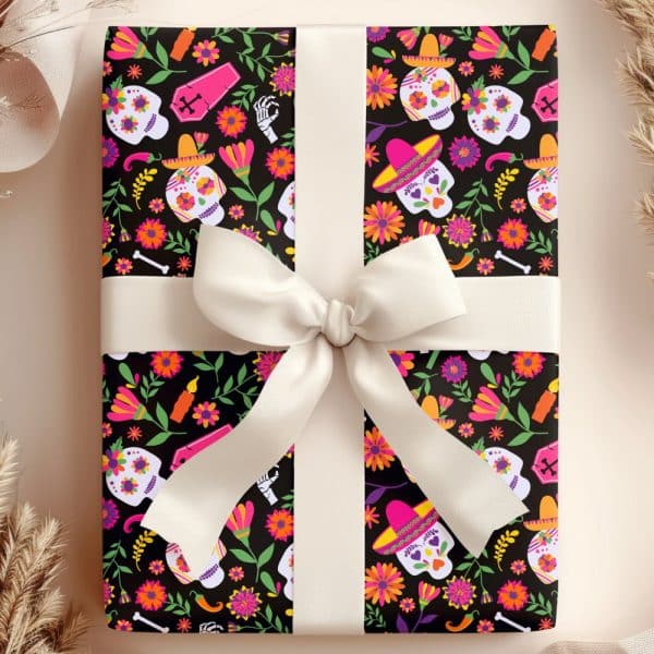 Gift Wrapped In Day Of The Dead Themed Paper Featuring Sugar Skulls And Flowers.