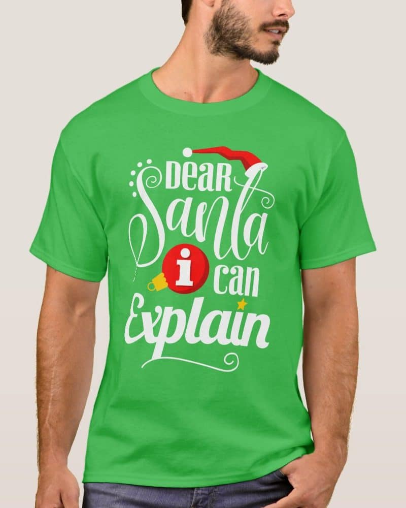 Man wearing a bright green t-shirt with a Christmas design that says Dear Santa I can explain.