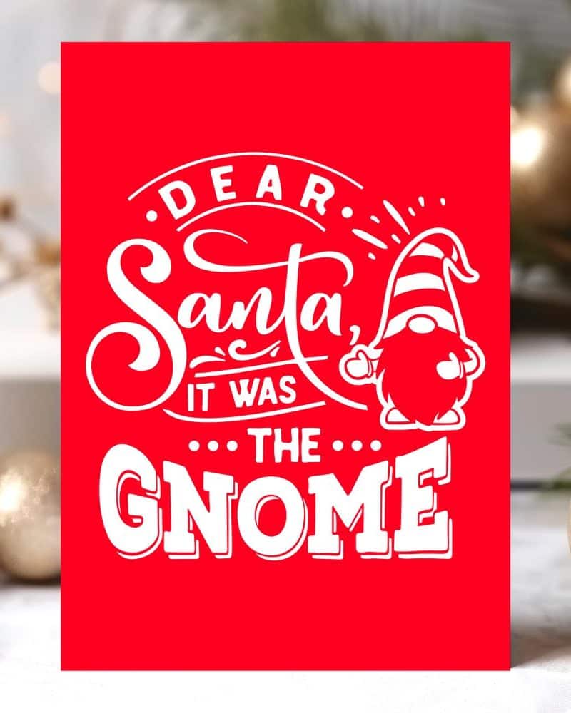 Red Christmas card featuring a gnome and the text Dear Santa, it was the gnome.