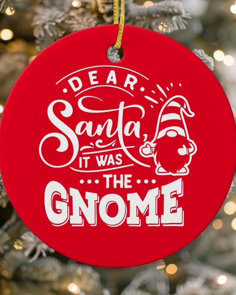 Red round Christmas ornament featuring a gnome and the text Dear Santa, it was the gnome.