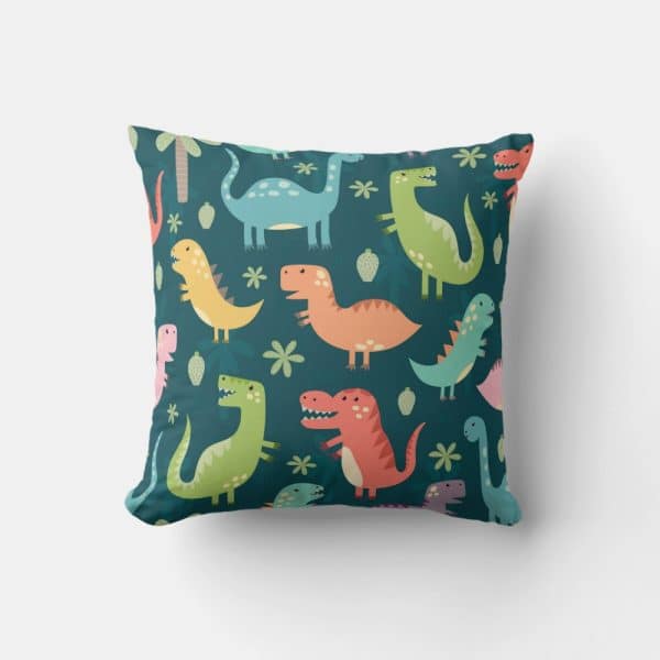 Square Pillow With A Teal Background And A Repeating Pattern Of Colorful Cartoon Dinosaurs.
