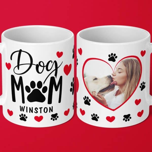 Two White Coffee Mugs. One Mug Says Dog Mom With Paw Prints And Hearts. The Other Mug Has A Heart-Shaped Photo Of A Woman Kissing A Dog, Surrounded By Paw Prints And Hearts.