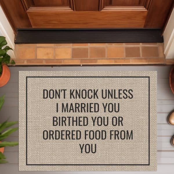 A Tan Doormat With Black Text That Reads Dont Knock Unless I Married You Birthed You Or Ordered Food From You.