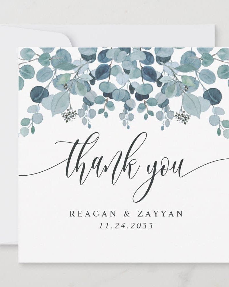 A thank you card with a watercolor eucalyptus border and the names Reagan & Zayyan and the date 11.24.2033.