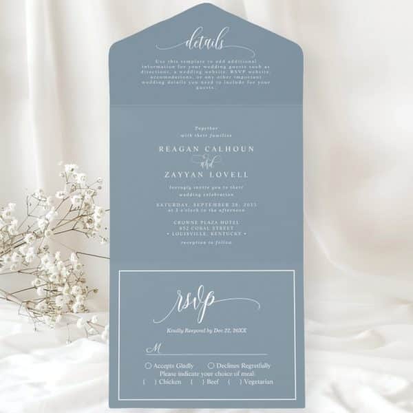 A Blue Wedding Invitation With The Names Reagan Calhoun And Zayyan Lovell, The Date, Time, And Location Of The Ceremony, And An Rsvp Section.