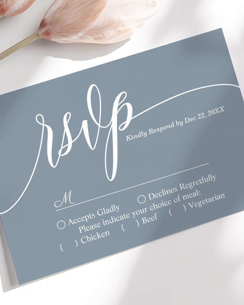 A light blue RSVP card with white script lettering.