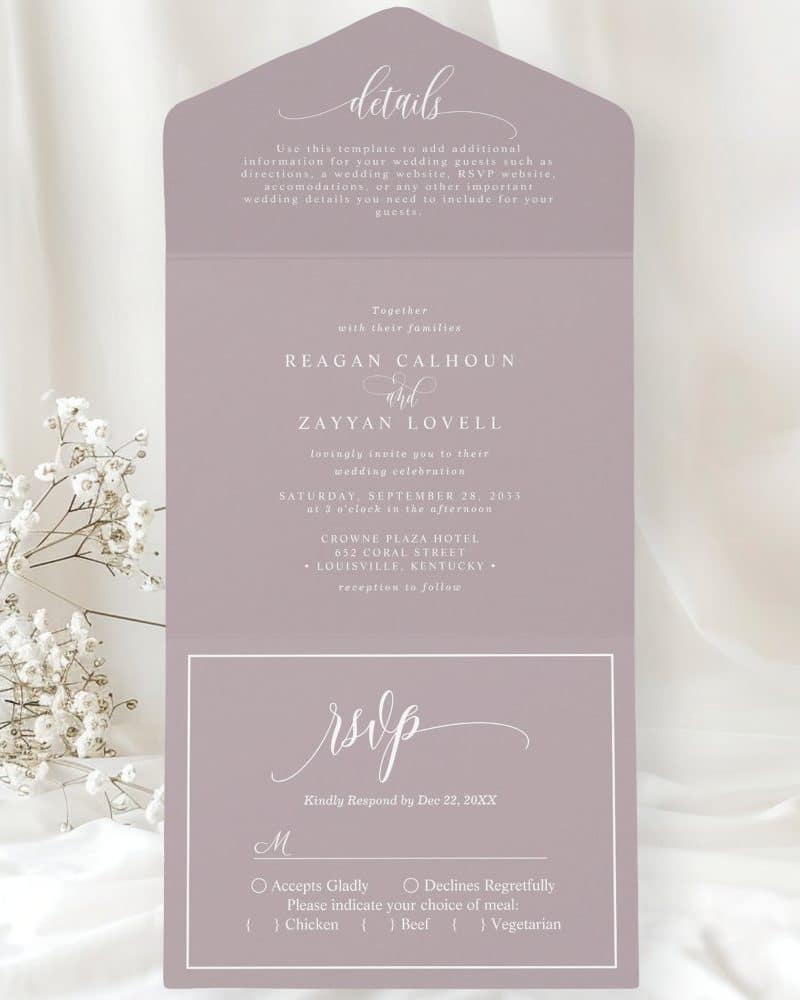 Purple wedding invitation with Regan Calhoun and Zayyan Lovell's names, wedding date, time, and location. RSVP details are included.