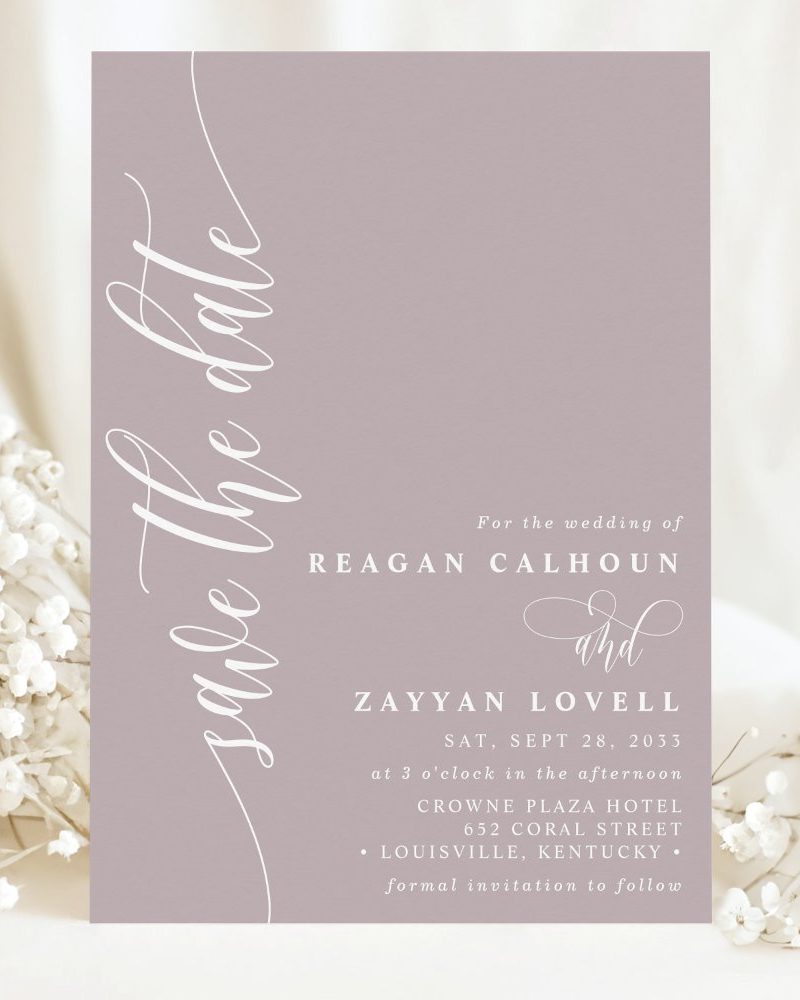 Dusty rose save-the-date for the wedding of Reagan Calhoun and Zayyan Lovell, September 28, 2033, at the Crowne Plaza Hotel in Louisville, Kentucky.