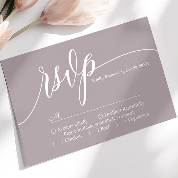 A Dusty Rose Rsvp Card With White Script Lettering.