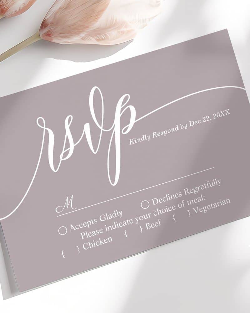 A dusty rose RSVP card with white script lettering.