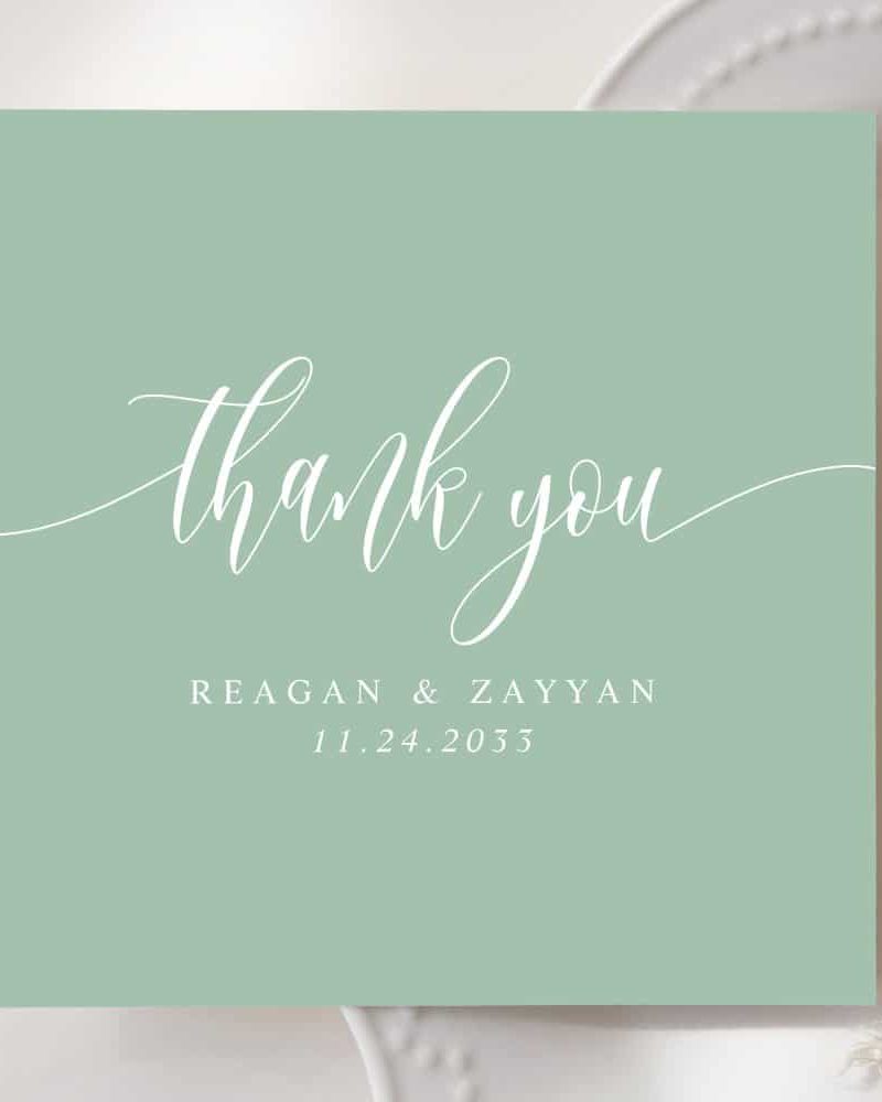 Sage green thank you card with white script lettering. The names Reagan & Zayyan and the date 11.24.2033 are also included.
