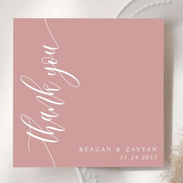 Dusty Rose Thank You Card With White Script Lettering. Names And Date Are Also In White At The Bottom.