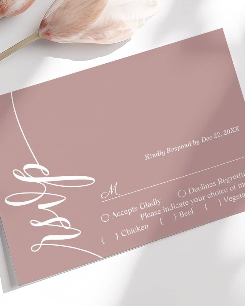 Dusty rose wedding RSVP card with elegant white script and meal choices.