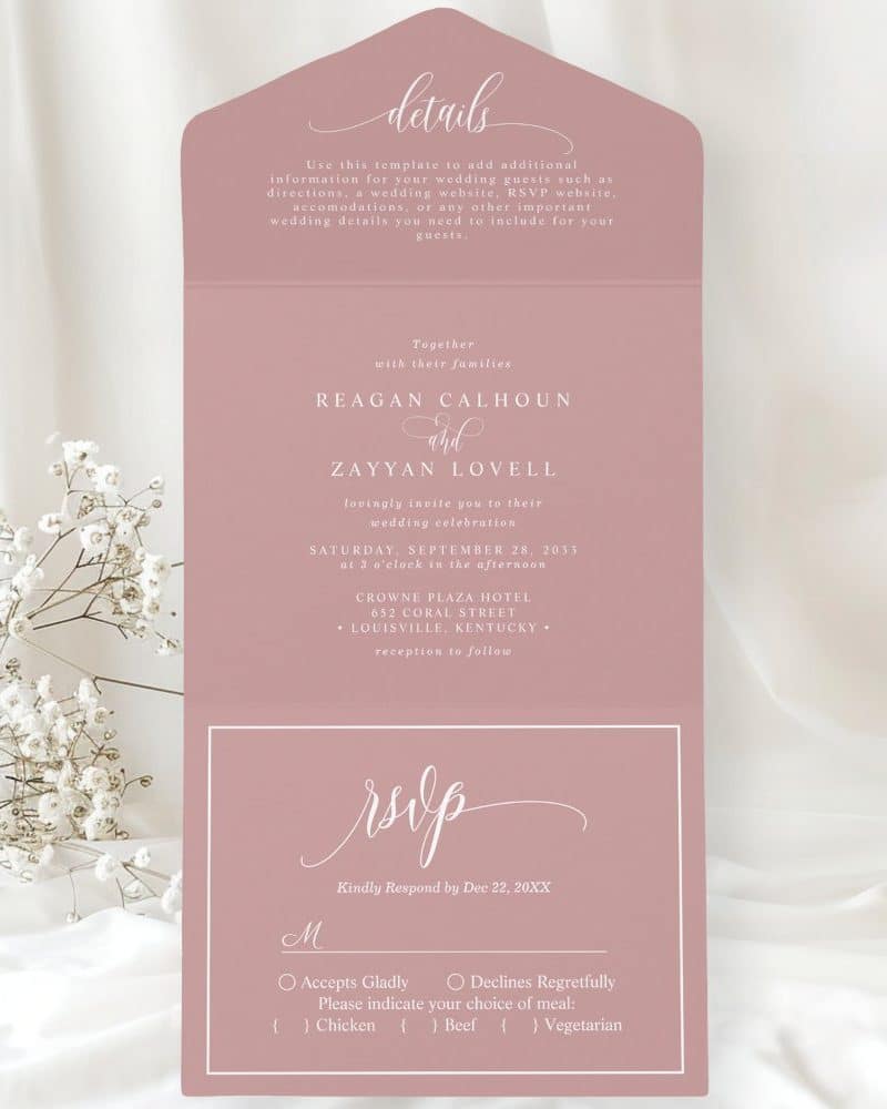 Dusty rose wedding invitation with the names Reagan Calhoun and Zayyan Lovell, date, time, and location. RSVP details are also included.