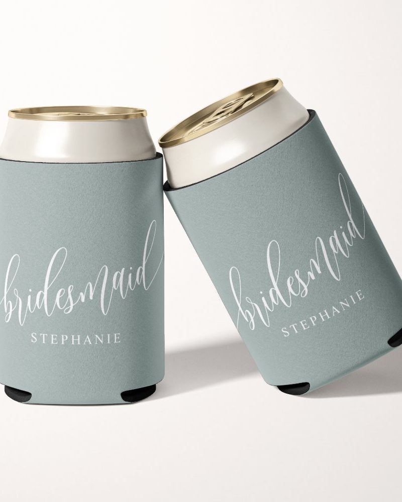 Two light blue can coolers with the word bridesmaid and a name, Stephanie, in white script.