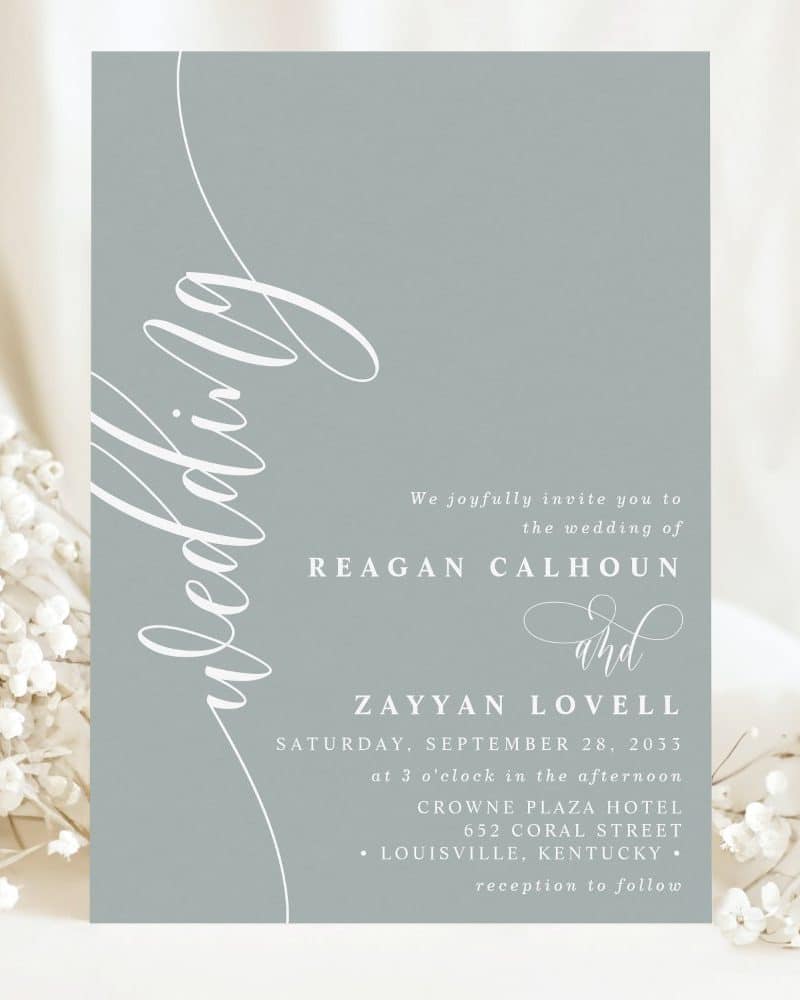 A light blue wedding invitation for Reagan Calhoun and Zayyan Lovell, September 28, 2033.