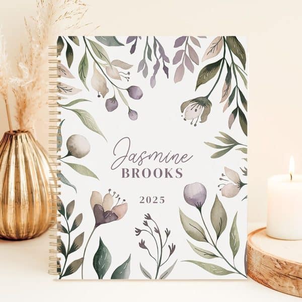 2025 Spiral-Bound Planner With Jasmine Brooks' Name And A Watercolor Floral Design.