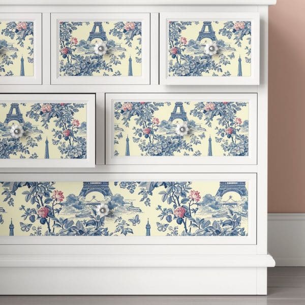 White Dresser Drawers With A Blue And Cream Parisian Toile Pattern.