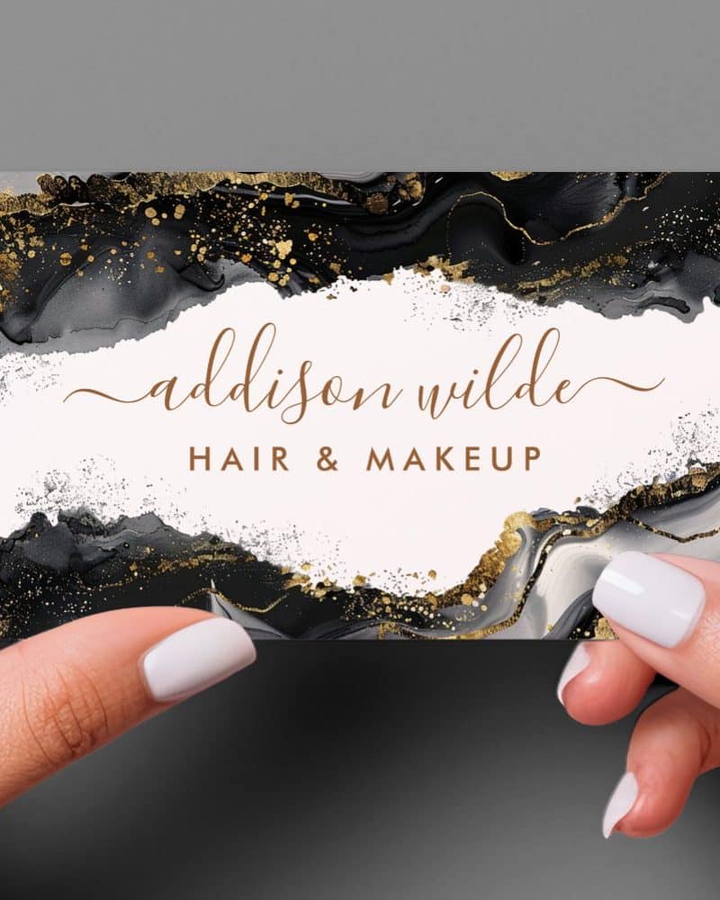 Business card with black and gold marble design, featuring the name Addison Wilde Hair & Makeup.