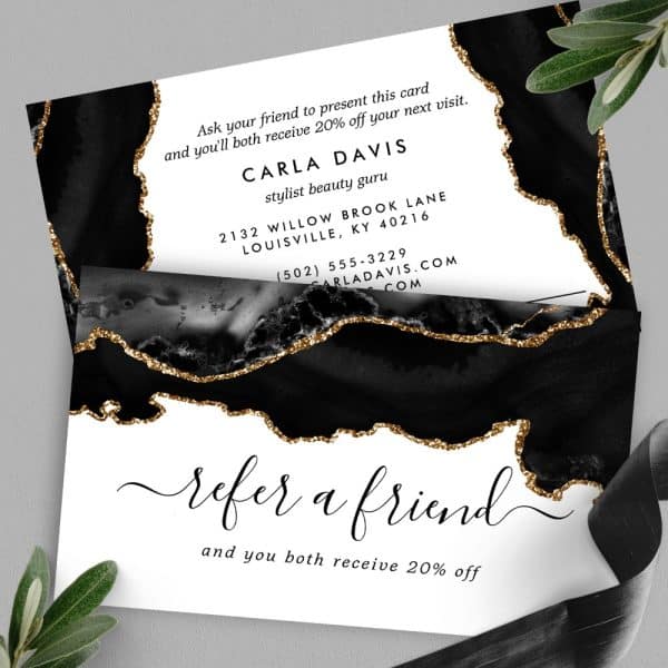 Black And Gold Referral Card For Carla Davis, Stylist And Beauty Guru, Offering 20% Off For Both Referrer And Friend.
