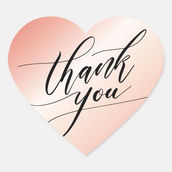 Rose Gold Heart-Shaped Sticker With The Words Thank You In Elegant Calligraphy.