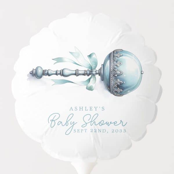 A White Balloon With A Blue And Silver Rattle And Ashley'S Baby Shower Details.