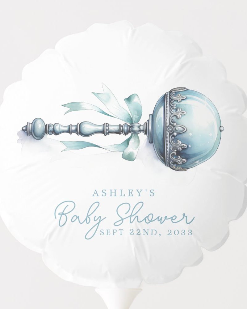 A white balloon with a blue and silver rattle and Ashley's baby shower details.