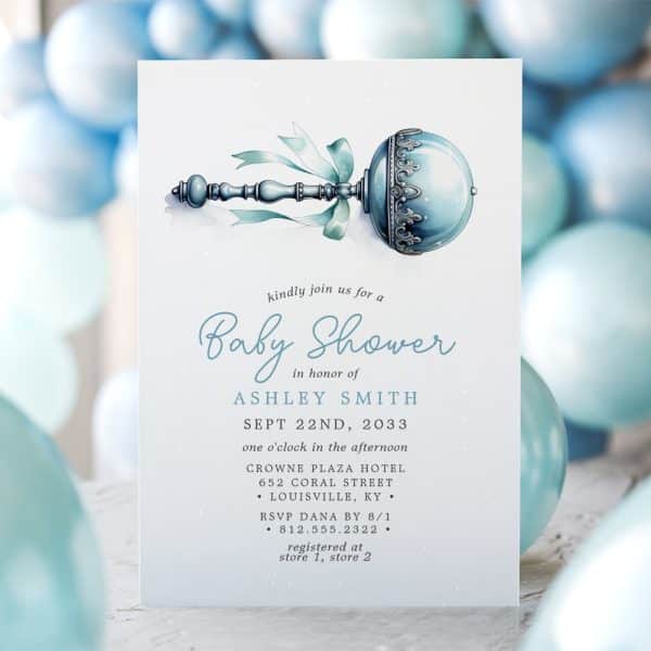 Baby Shower Invitation Featuring A Watercolor Illustration Of A Blue Rattle.