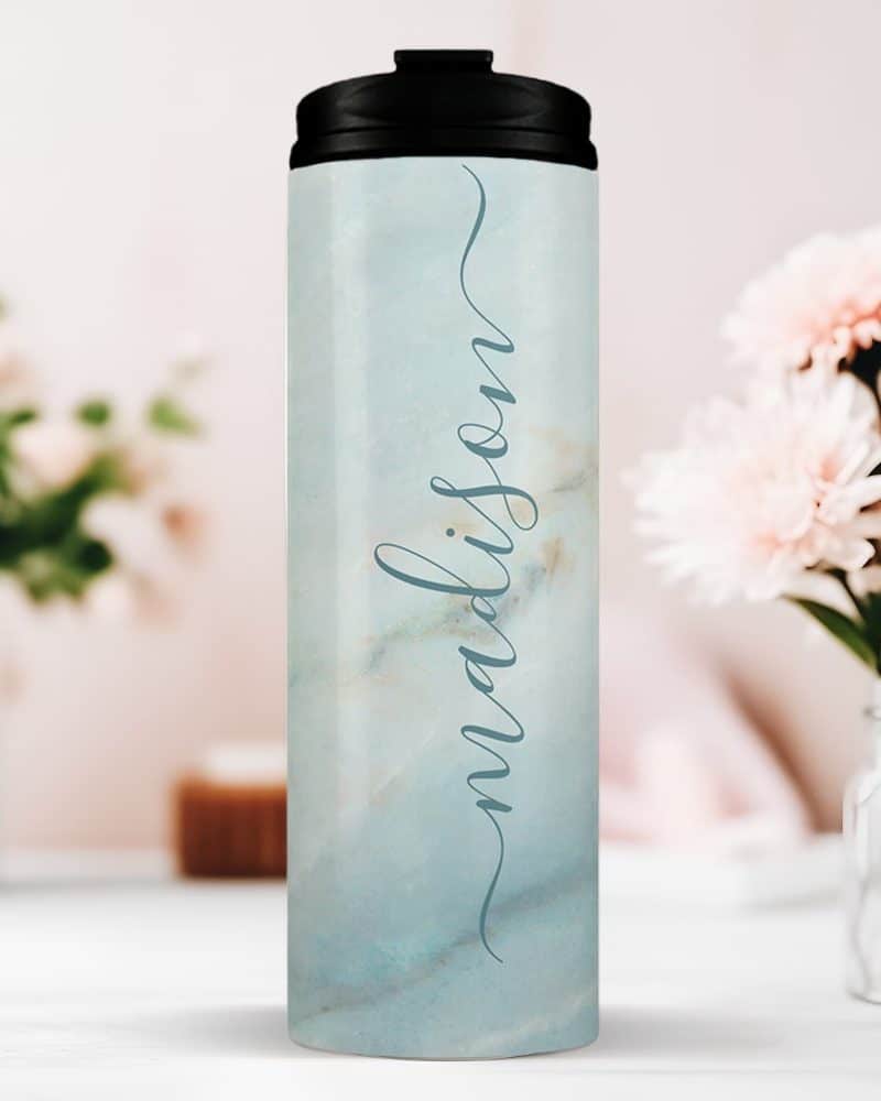 Personalized light blue marble tumbler with the name Madison.