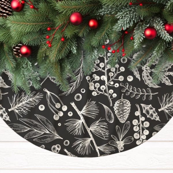 Black Christmas Tree Skirt With A Silver Botanical Print, Adorned With Evergreen Boughs And Red Ornaments.