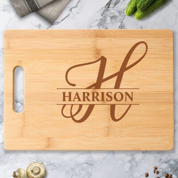 Personalized Bamboo Cutting Board With The Letter H And The Name Harrison Engraved.