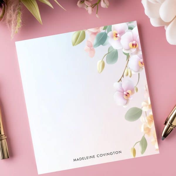 Floral Stationery Featuring Pink Orchids In The Corner, With A Name At The Bottom.