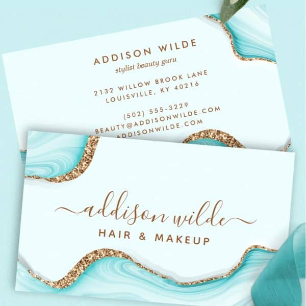 Business Card For Hair And Makeup Stylist Addison Wilde. The Card Features A Teal And Gold Design.