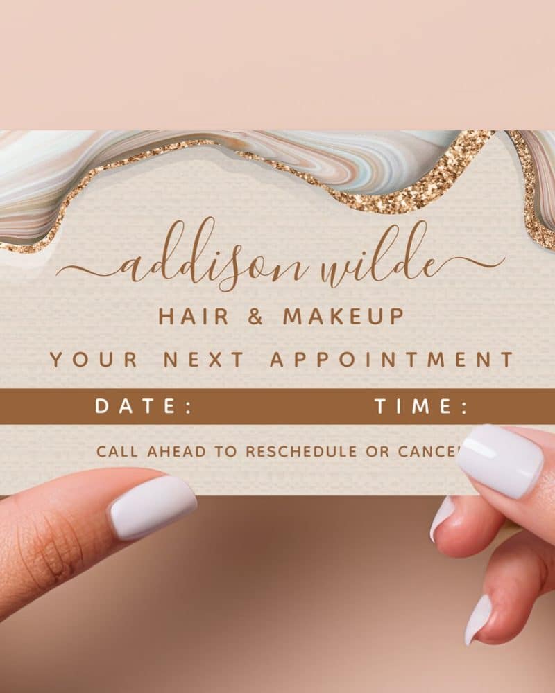 Appointment card for Addison Wilde Hair & Makeup, featuring an abstract design.