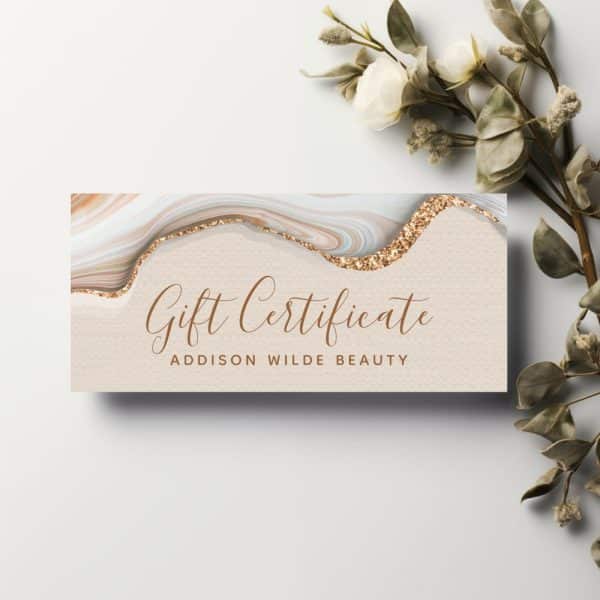 Addison Wilde Beauty Gift Certificate With A Marble And Gold Glitter Design.
