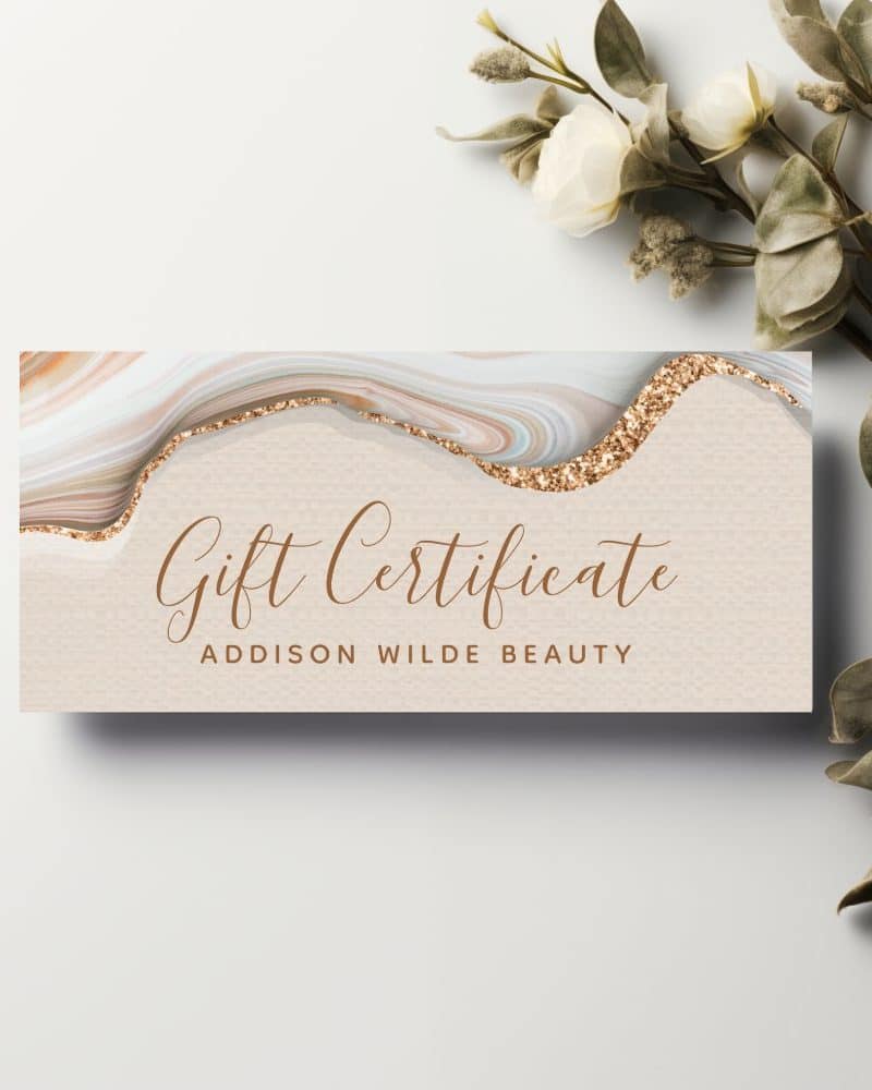 Addison Wilde Beauty gift certificate with a marble and gold glitter design.