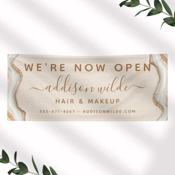 Grand Opening Announcement For Addison Wilde Hair &Amp; Makeup, Featuring A Beige Banner With Gold Accents.