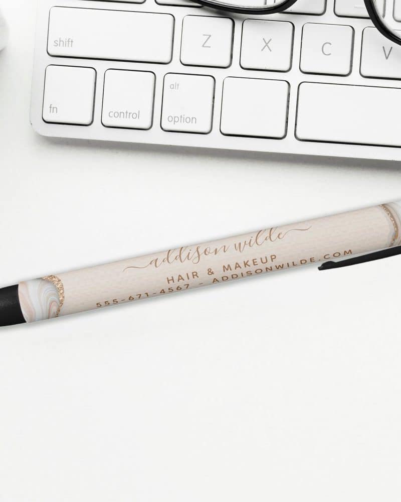 Pen with Addison Wilde Hair & Makeup logo and contact information.