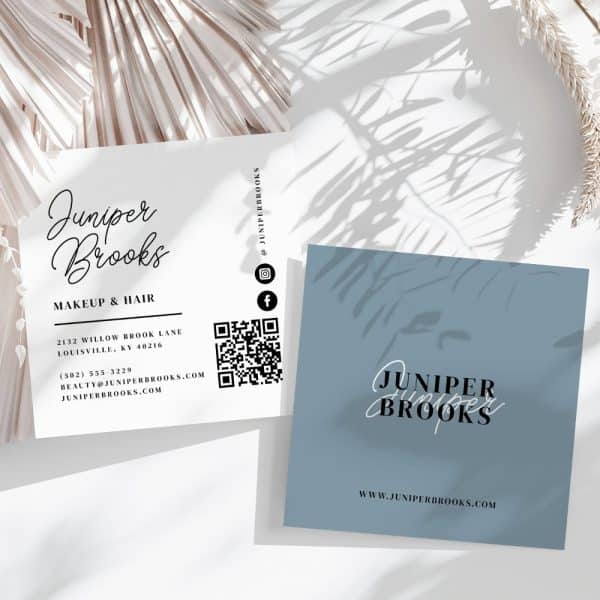Two Business Cards For Juniper Brooks Makeup &Amp; Hair. One Card Is White With Contact Information And A Qr Code, And The Other Is Light Blue With Only The Business Name And Website.