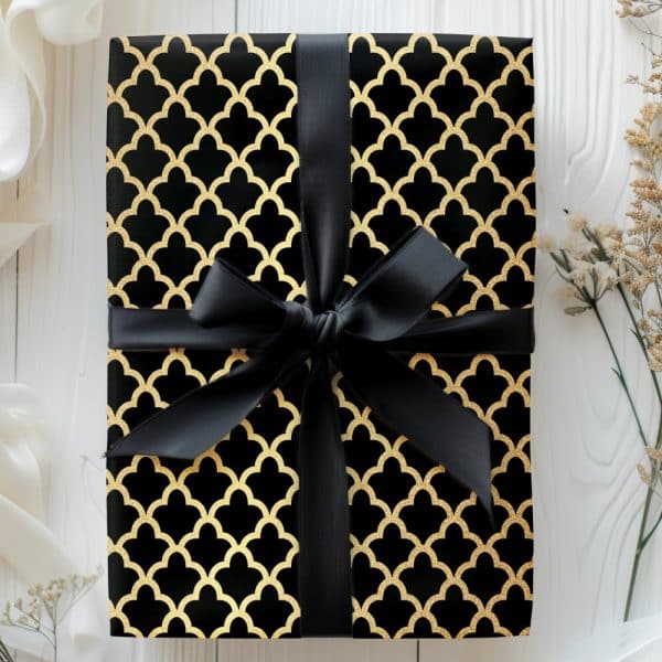 Black Gift Box With Gold Geometric Pattern And Black Ribbon.