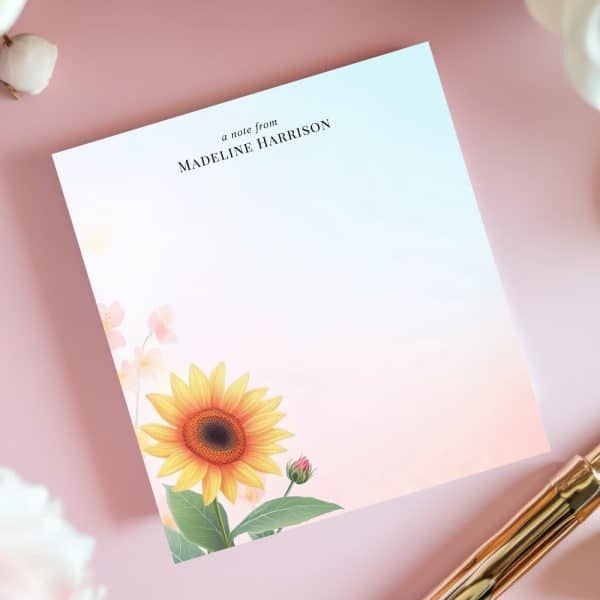 Personalized Stationery Featuring A Sunflower And Other Flowers On A Pastel Background.