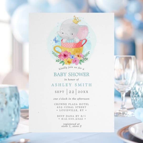 Baby Shower Invitation Featuring A Cartoon Elephant Wearing A Crown And Sitting In A Teacup Surrounded By Flowers.